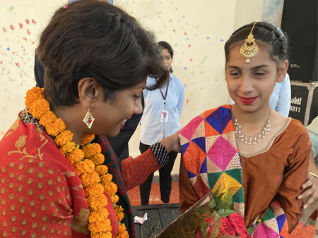 Dr. Malini Saba engaging with a Young Girl during the Inauguration of the School She Donated Funds to Construct.